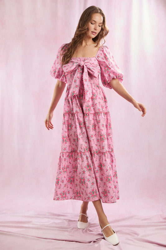 Bailey Floral Bow Front Maxi Dress in pink floral cotton poplin. Features puff sleeves and a statement front bow. Available in sizes XS-XL.
