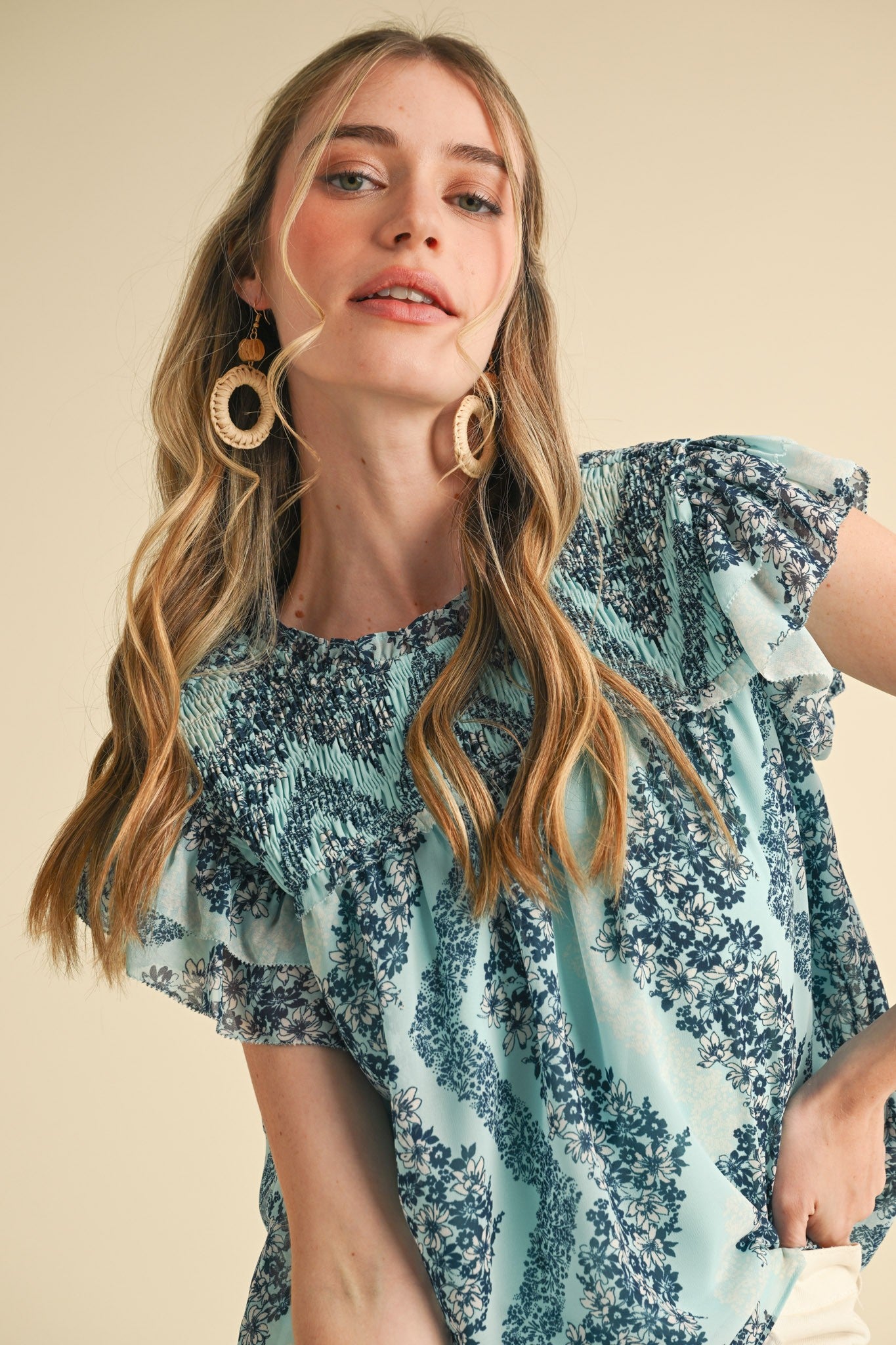 Teal Floral Smocked Yoke Ruffle Trim Top with ruffled sleeves. Available in sizes XS-XL.