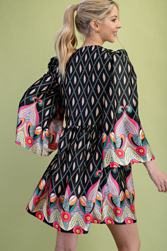 Nora Notch Neck Mini Dress featuring colorful florals and geometric patterns, wide bell sleeves, and a flared skirt. Available in sizes XS–XL.