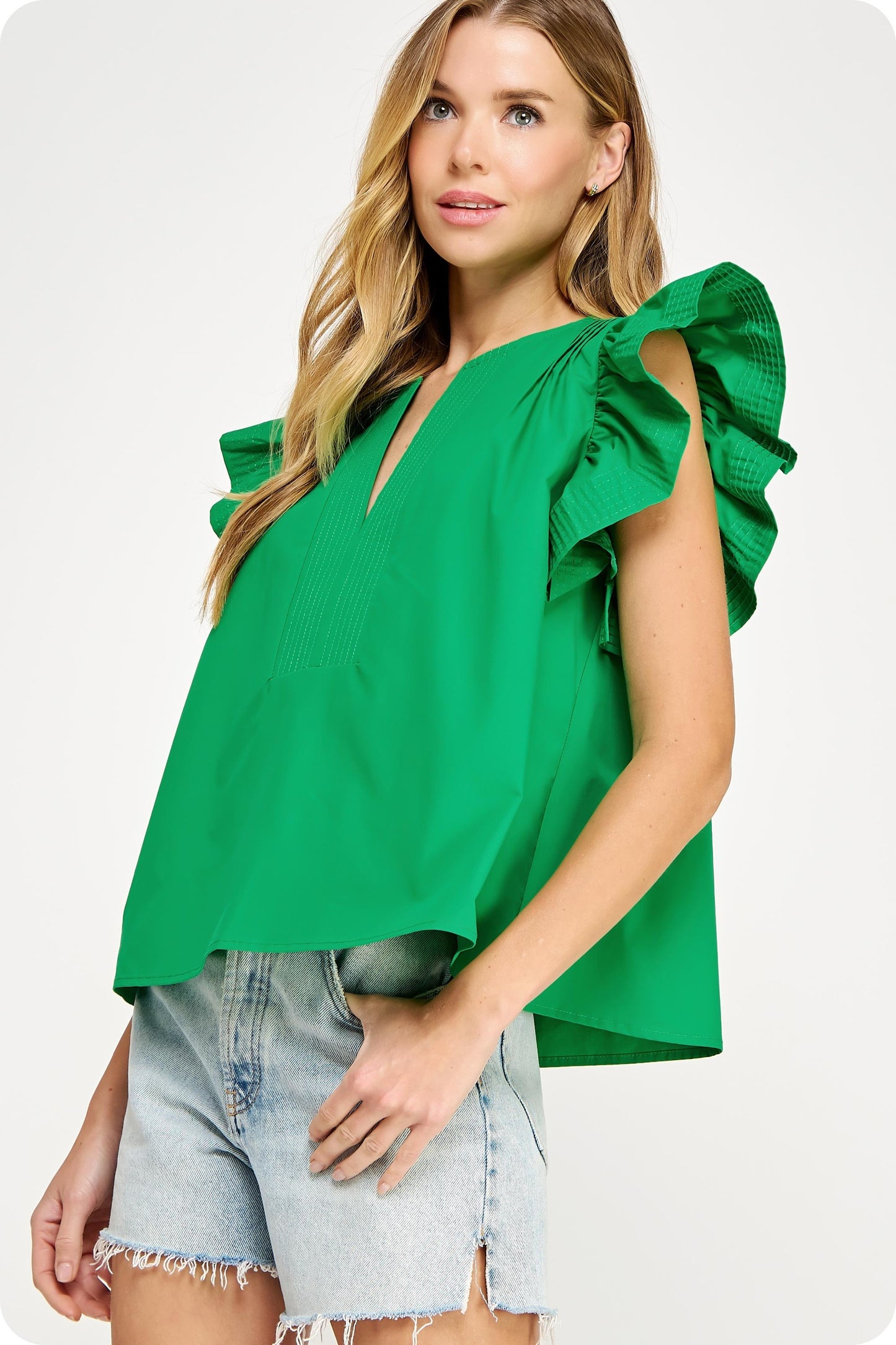 Bright green Flutter Sleeve Tunic Top with V-neck and short sleeves. Available in sizes XS–XL.