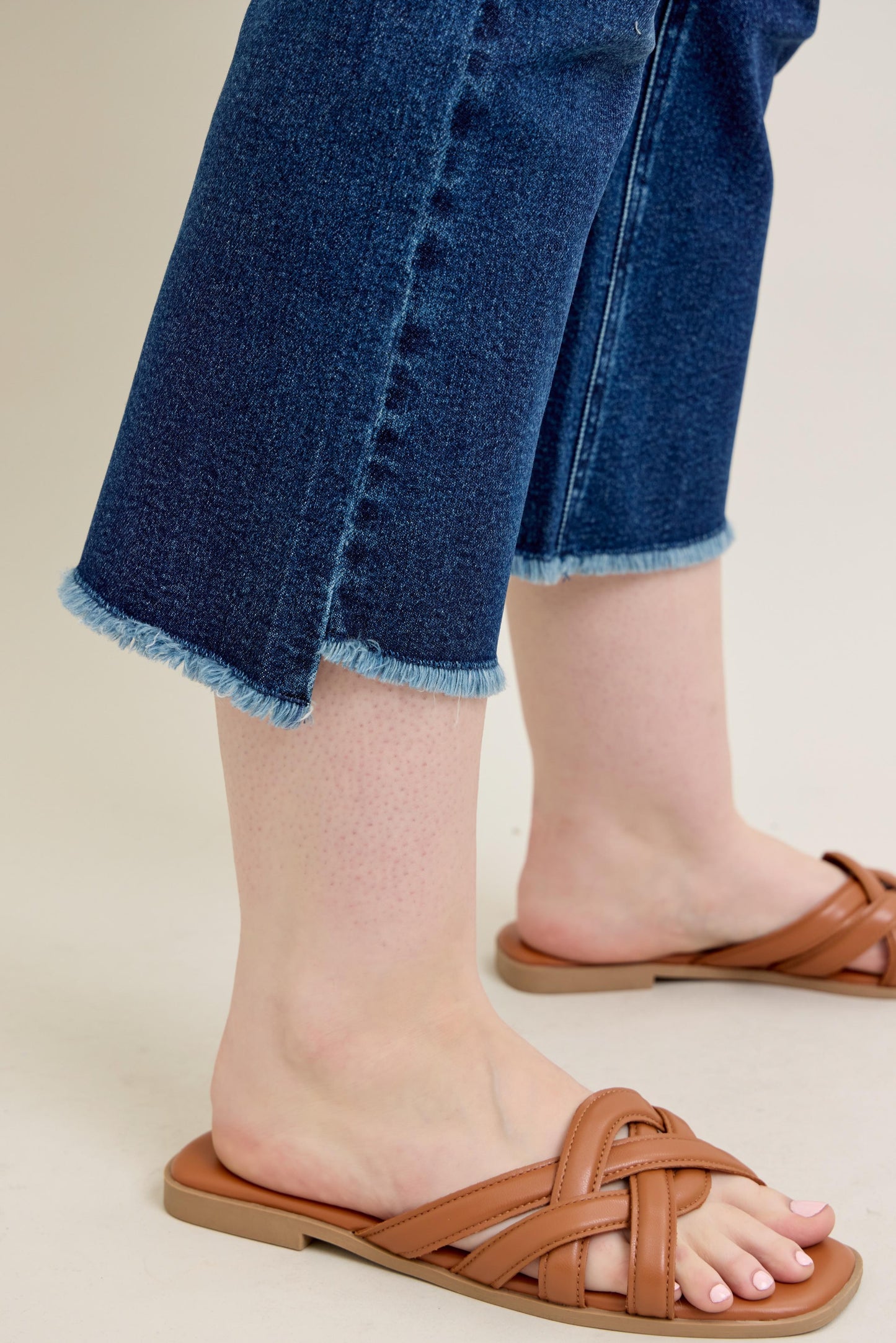 Judy Blue HW Dark Wash Kick Flare Jeans with cropped, frayed hem. Available in sizes 0-20.