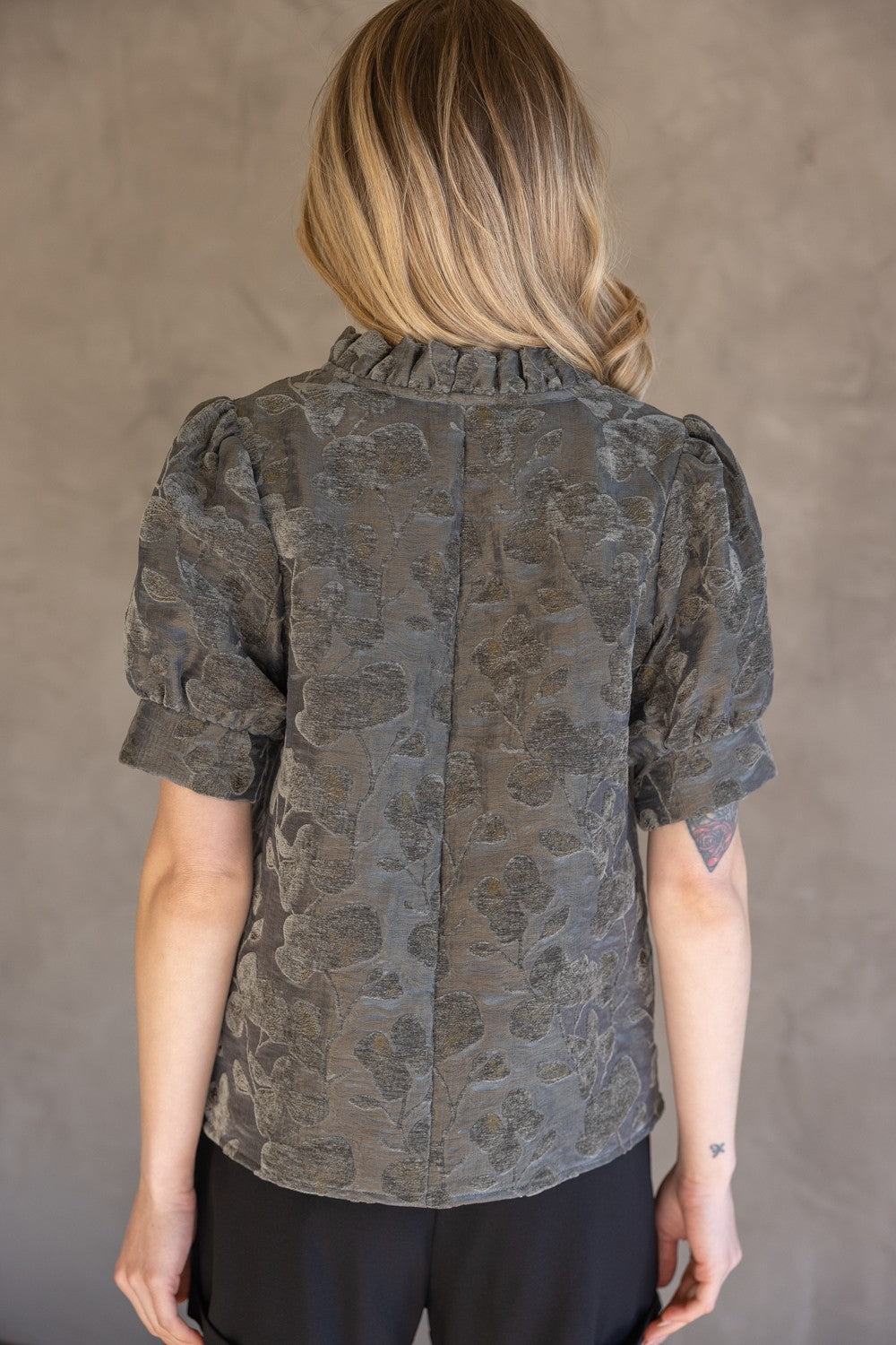 Charcoal Ruffled V-Neck Textured Velvet Top with puff sleeves and ruffled collar. Available in sizes XS-XL.