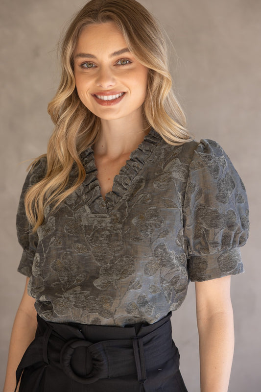 Charcoal Ruffled V-Neck Textured Velvet Top with puff sleeves. Available in sizes XS–XL.
