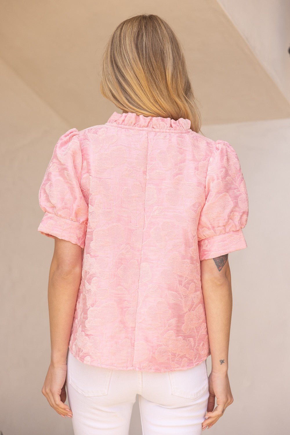 Poppy Ruffled V-Neck Floral Top: light pink, textured, puffed sleeves, ruffled collar. Available in sizes XS-XL.