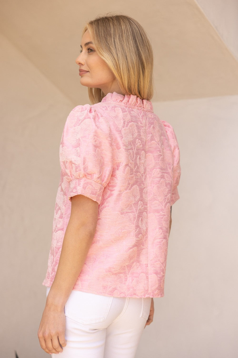 Poppy Ruffled V-Neck Floral Top in textured light pink. Available in sizes XS–XL.