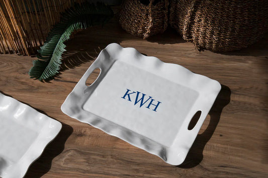 White VIDA Havana Rectangular Tray with handles, blue "KWH" monogram, wavy edges, melamine. Sizes: small, medium, large.