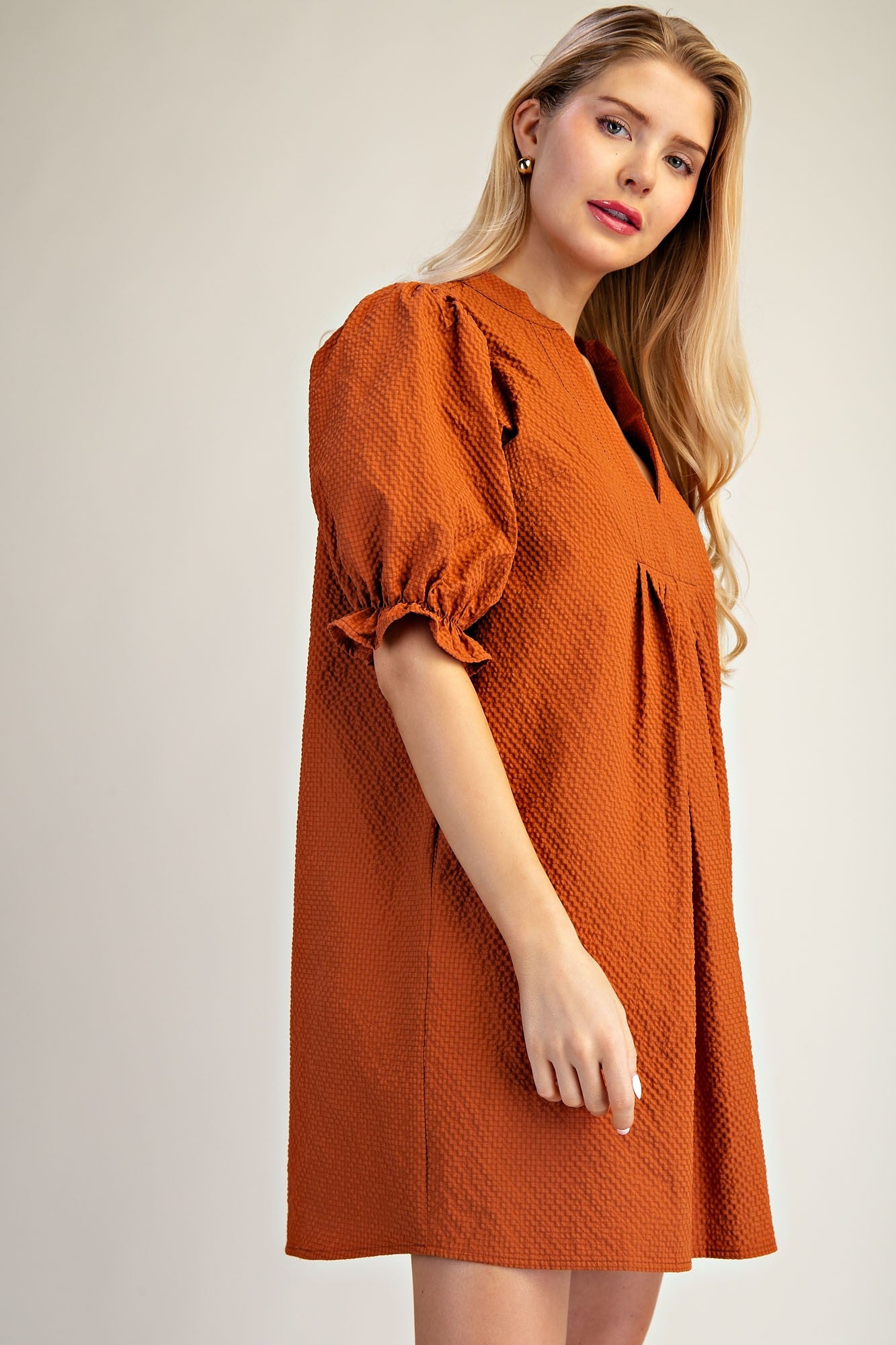 Lyla Puff Sleeve Dress in orange with textured fabric and puff sleeves. Available in sizes XS-XL.