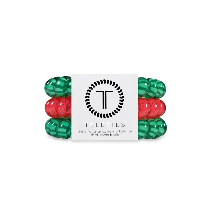 Pack of three TELETIES hair ties (two green, one red) with white label. Available in small and large sizes.