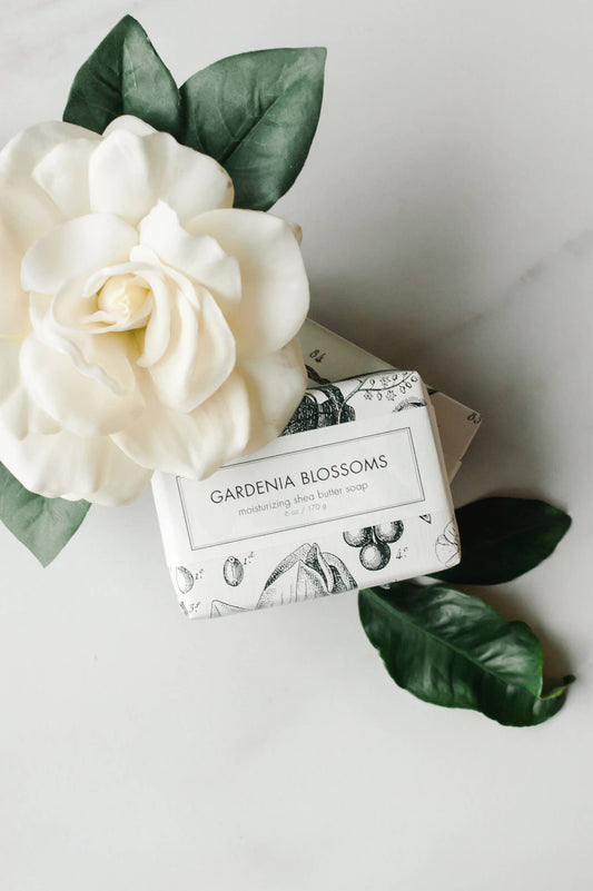 This is a Gardenia Blossoms Soap - Bath Bar. It's presented in a pristine white color, inspired by the real gardenia flower. The soap offers a refreshing floral scent and is designed to provide gentle cleansing for your skin. This item comes in standard soap bar size.
