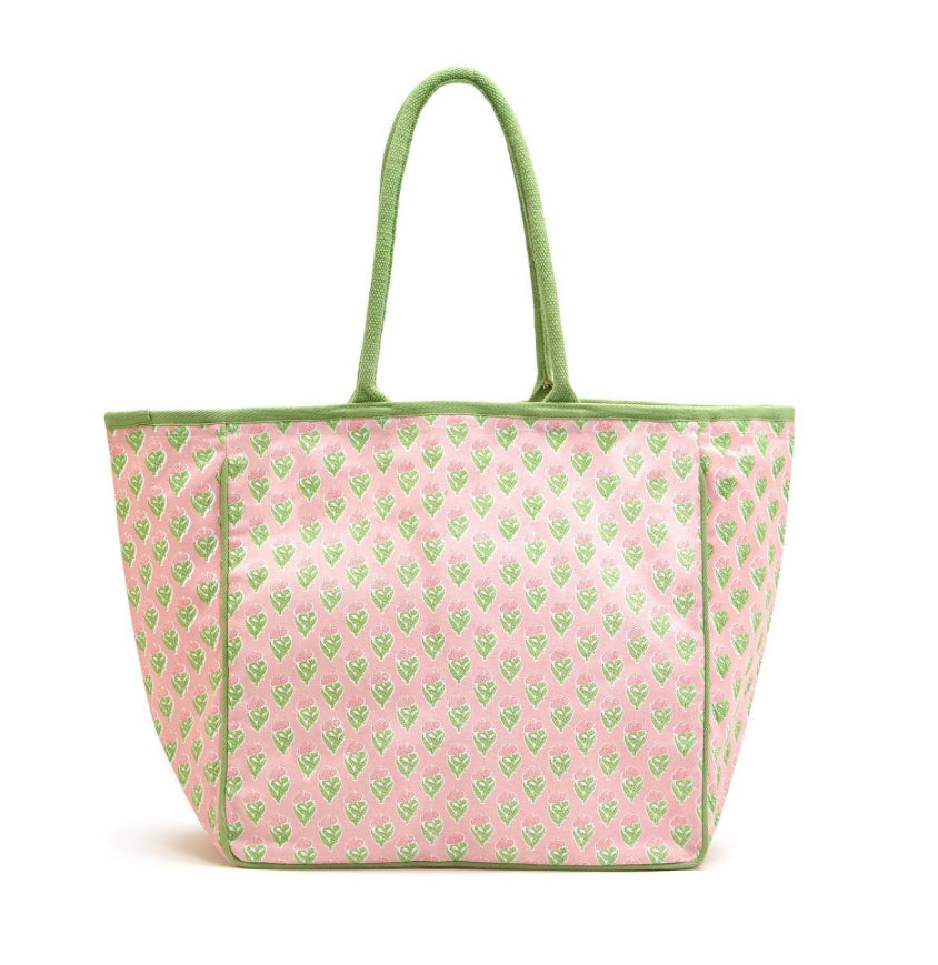 Spacious cotton canvas tote with green handles and trim, pink background, heart patterns. Available in multiple sizes.