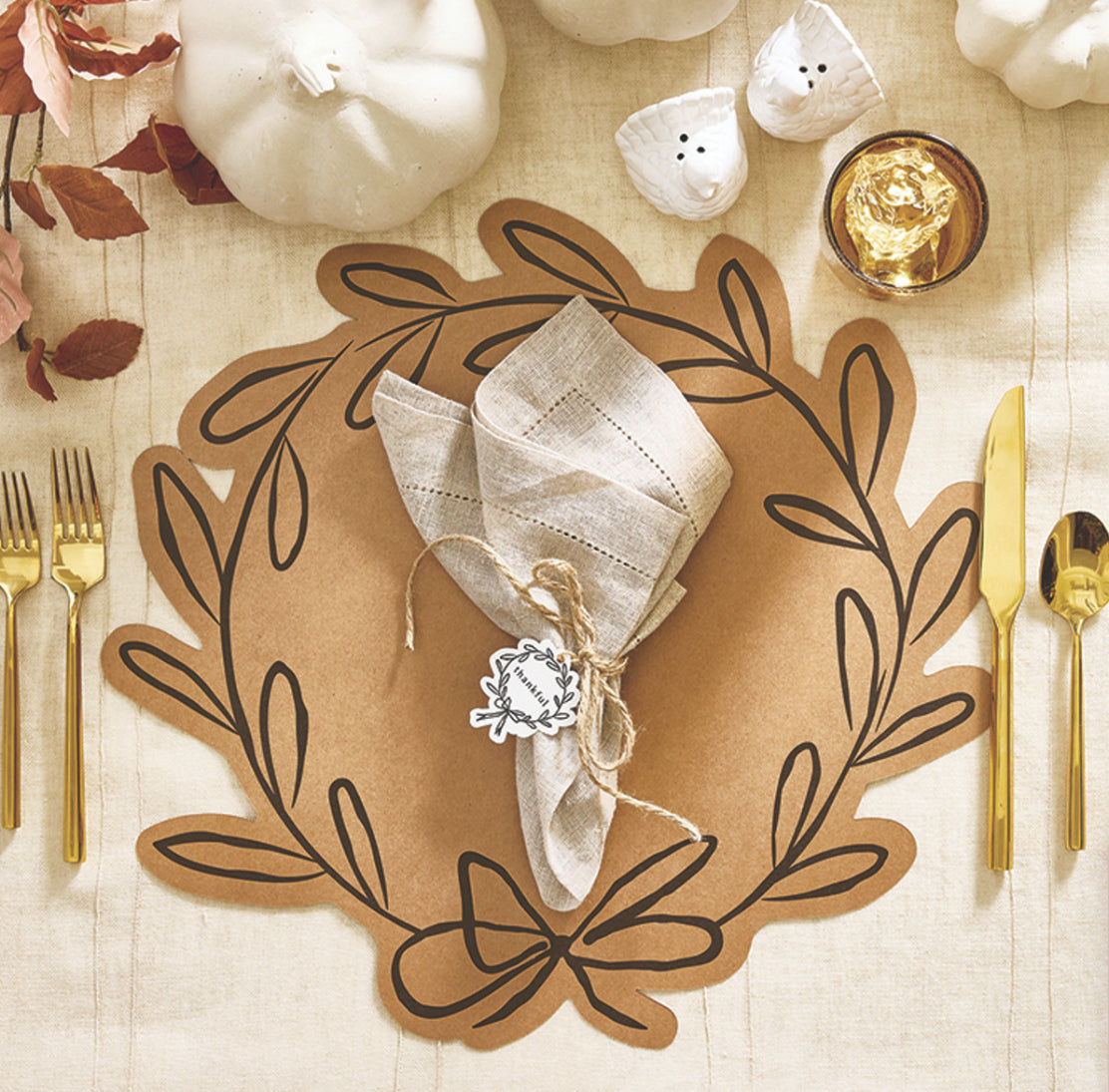 Laurel Wreath Paper Place Mats, available in 11"x17" size, shown arranged on a fall-themed table setting.