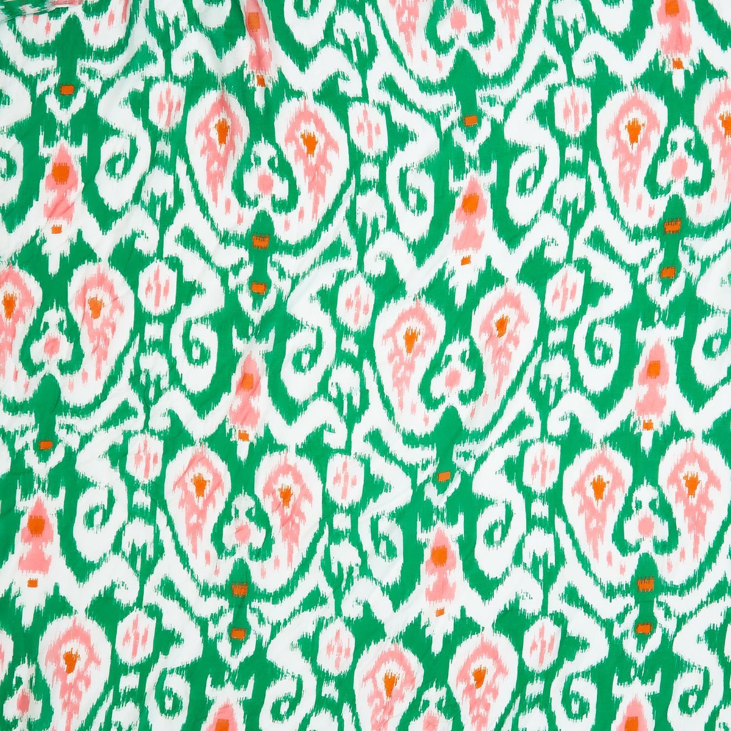 Green short kimono with vibrant Ikat pattern in green, white, and peach. Available in sizes S, M, L.