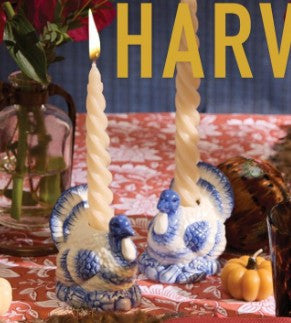 Blue and White Hand-Painted Turkey Candleholders with two lit spiral candles. Available in standard and large sizes.