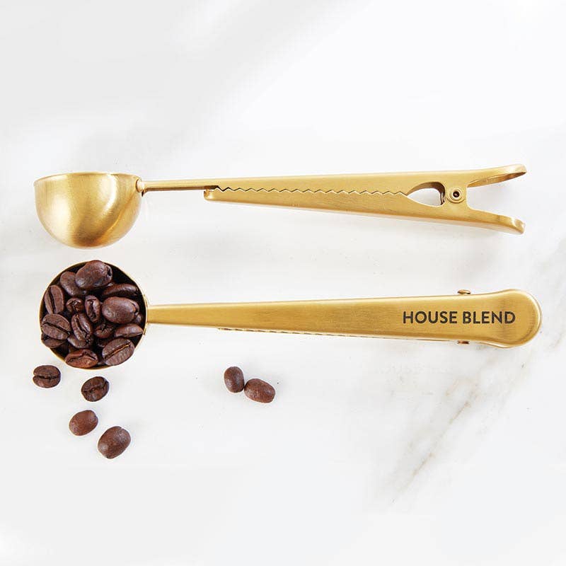 The Coffee Clip + Scoop - House Blend: two gold stainless steel scoops with serrated handles; available in standard size.