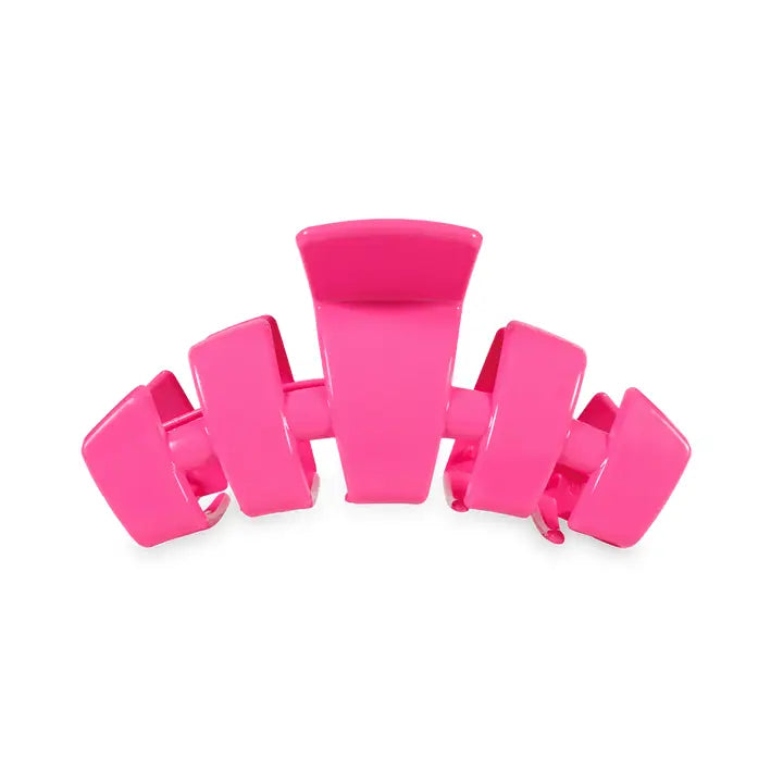 Bright pink TELETIES Classic Claw Hair Clip with wide grip and curved teeth. Available in small, medium, and large sizes.