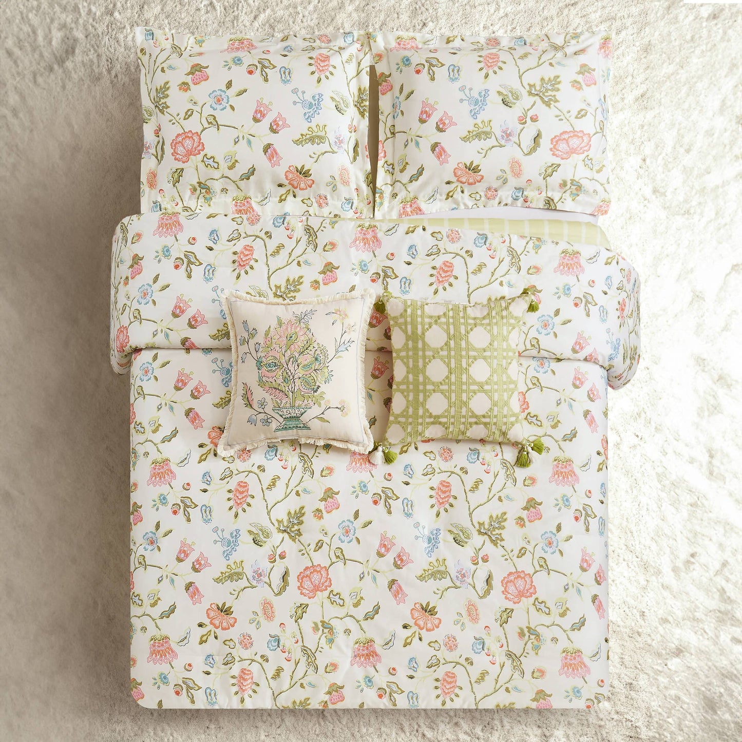 White bedding with a vibrant floral print, available in twin, queen, and king sizes.