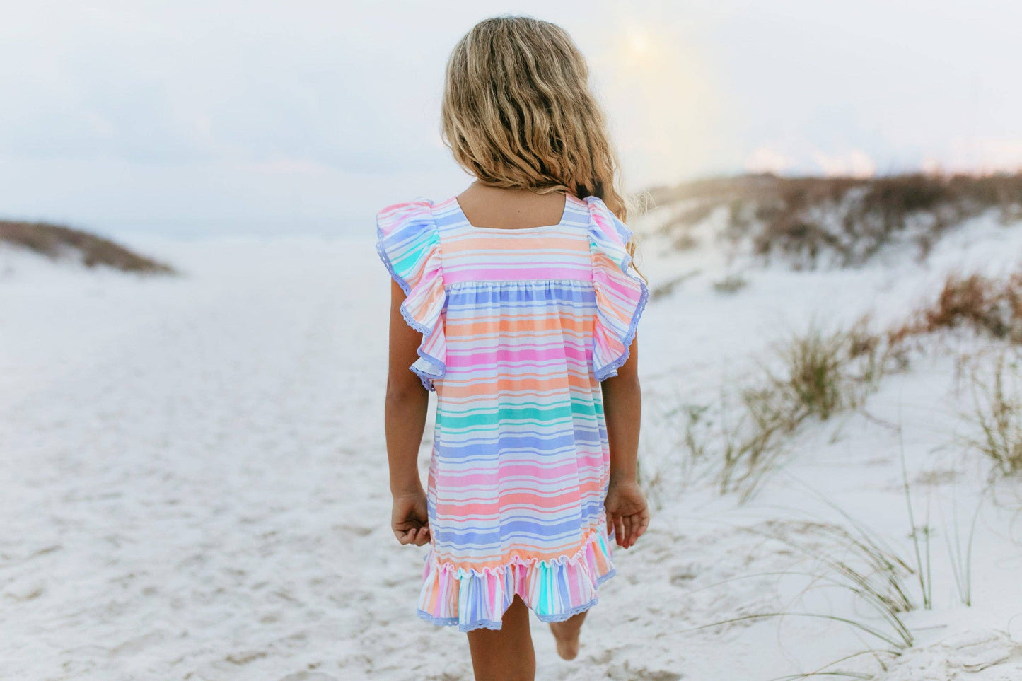 Girls Pastel Rainbow Stripe Ruffles & Lace Spring Dress, available in sizes 2T-10, features ruffled sleeves and lace trim.