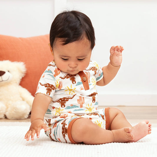 Happy Trails Bamboo Henley Short Romper with longhorn, cacti, and sun prints. Available in sizes NB-24M.