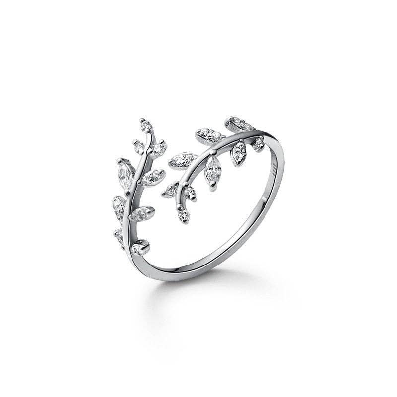 Gold and silver olive leaf branch band ring with sparkling stones in 925 sterling silver. Available sizes: 6, 7, 8.