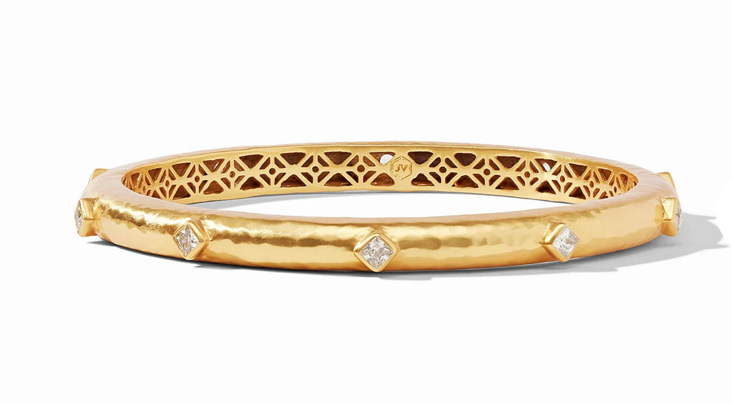 Gold hammered bangle with inner piercework and five square-cut diamonds; available in multiple sizes.