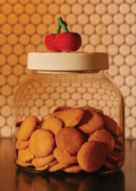 Super Canister glass jar with white lid and cherry-shaped handle; available in multiple sizes.