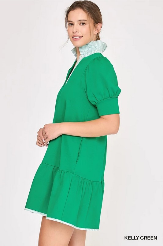 High Ruffle Neck Dress: short, loose green dress with puff sleeves, button-down front, white-striped collar and hem. Sizes XS-XL.