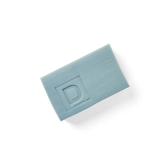 Rectangular blue Big Ass Brick of Soap - Midnight Swim, raised "D" and "STOCKTHE.DOT" text, made in America. Available sizes: 10 oz.
