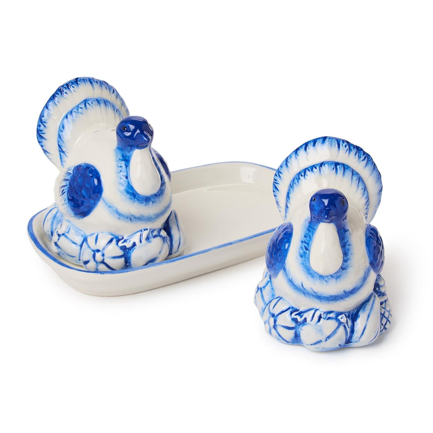 Set of two blue and white handpainted ceramic turkey salt and pepper shakers with matching tray; available in one standard size.