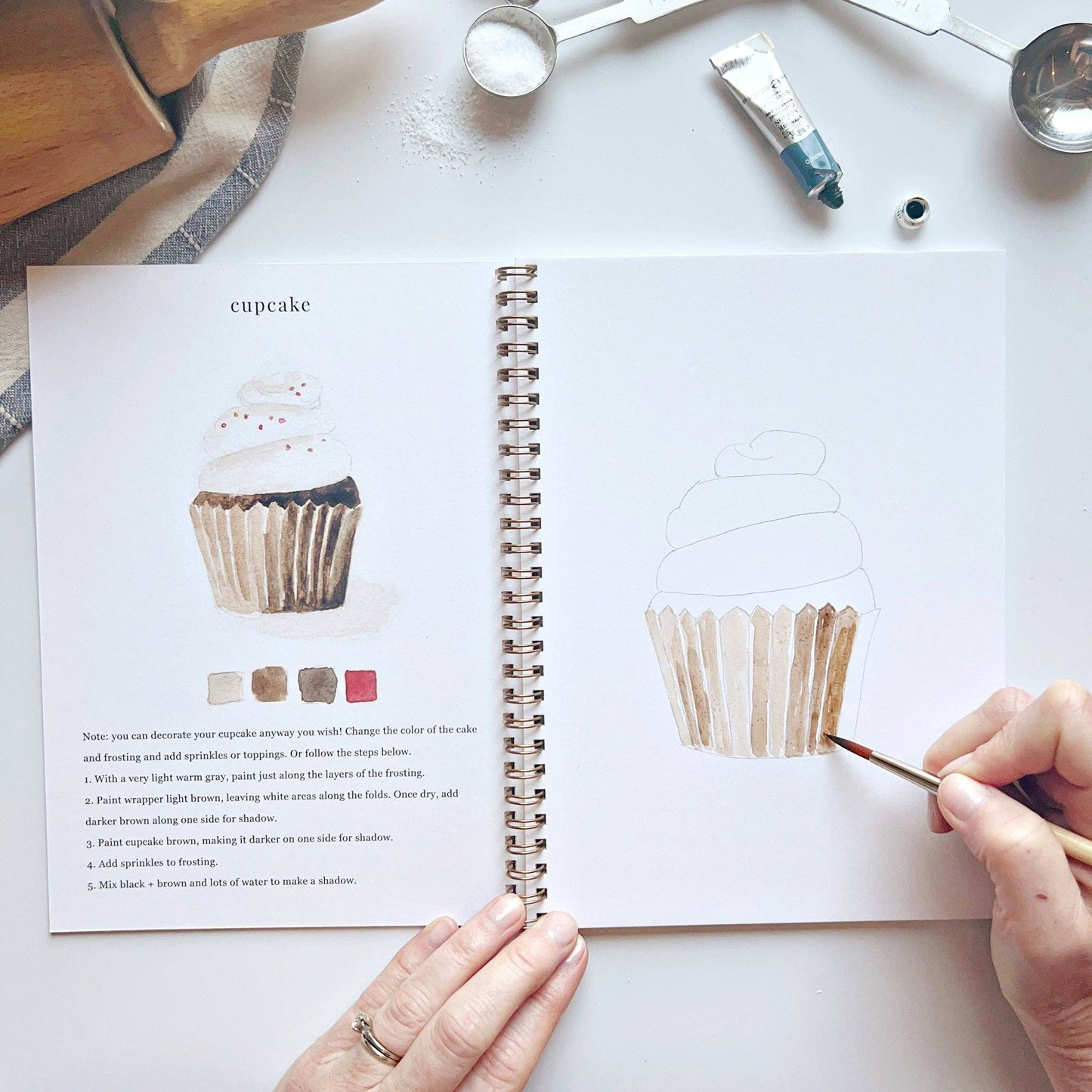 Baking Watercolor Workbook with finished cupcake example and outline; available in multiple sizes.