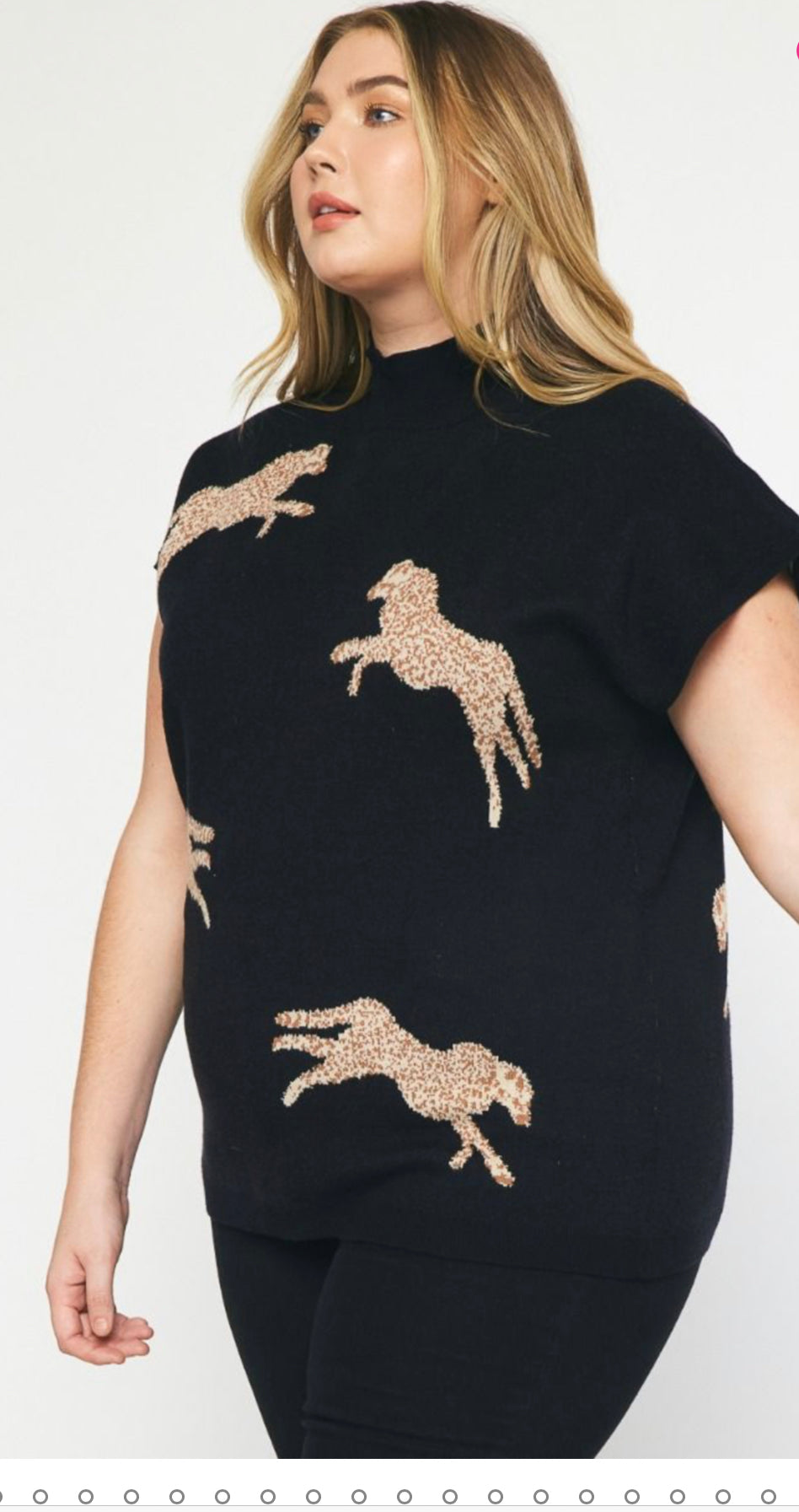 A woman wearing a Leopard Print Cropped Sweater Plus with beige leopard print designs. She has long blonde hair and is posing against a light background.