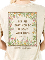Beige Floral Love Bible Verse Shirt with floral border, “LET ALL THAT YOU DO BE DONE WITH LOVE.” from 1 Corinthians 16:14, and “simply southern” at the bottom. Available in sizes S–XXL.