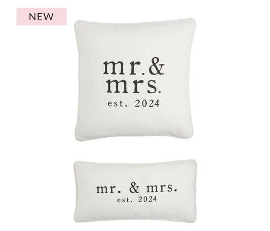 These bridal pillows the lumbar white with black writing that says Mr. and Mrs. estimated 2024 is 11 x 22 the square that also says Mr. and Mrs. estimate 2024 is 16 1/2" x 16 1/2"