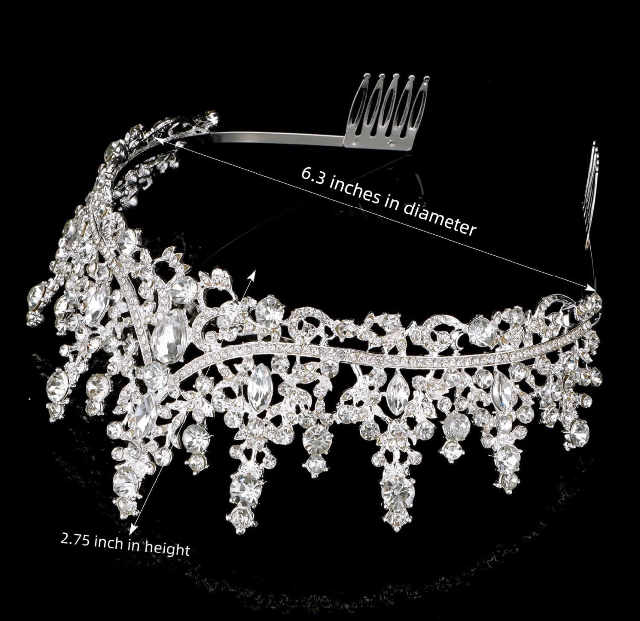 Silver tiara with clear crystals, floral and teardrop details. Size: 6.3" diameter, 2.75" tall.