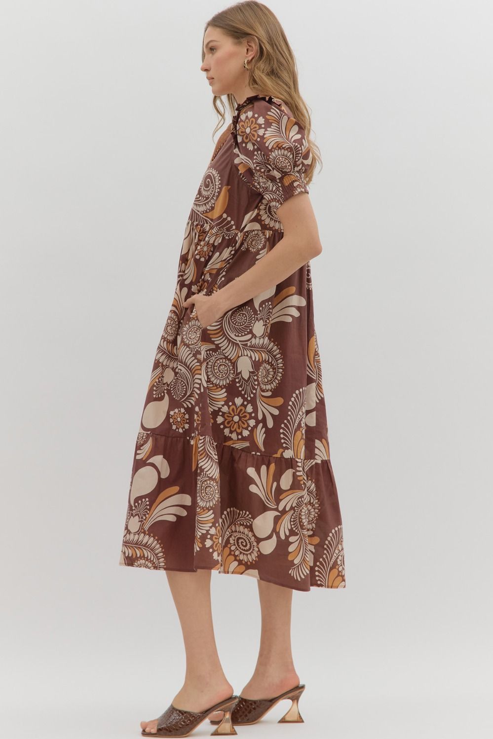 Betty Floral Dress: Loose, knee-length brown dress with bold cream and orange florals. Available in sizes XS–XL.