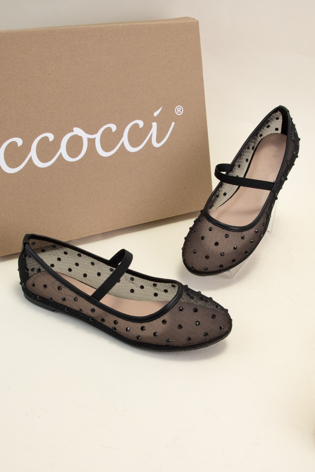 Rhinestone Embellished Mesh Mary Jane Flats featuring black sheer material with polka dots and a top strap. Slightly pointed toe, low profile. Sizes: 5-10.