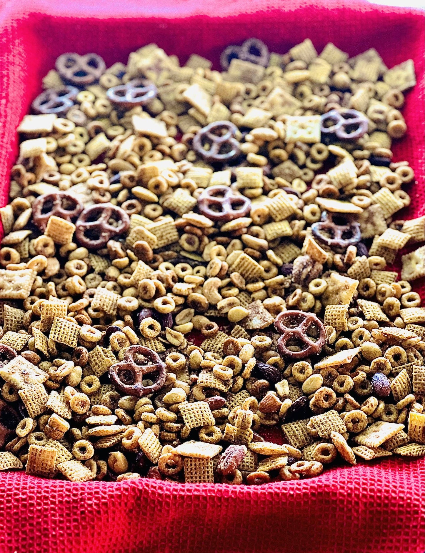 Homemade snack mix dusted with Snickerdoodle Cracker Seasoning. Available in 8oz and 16oz sizes.