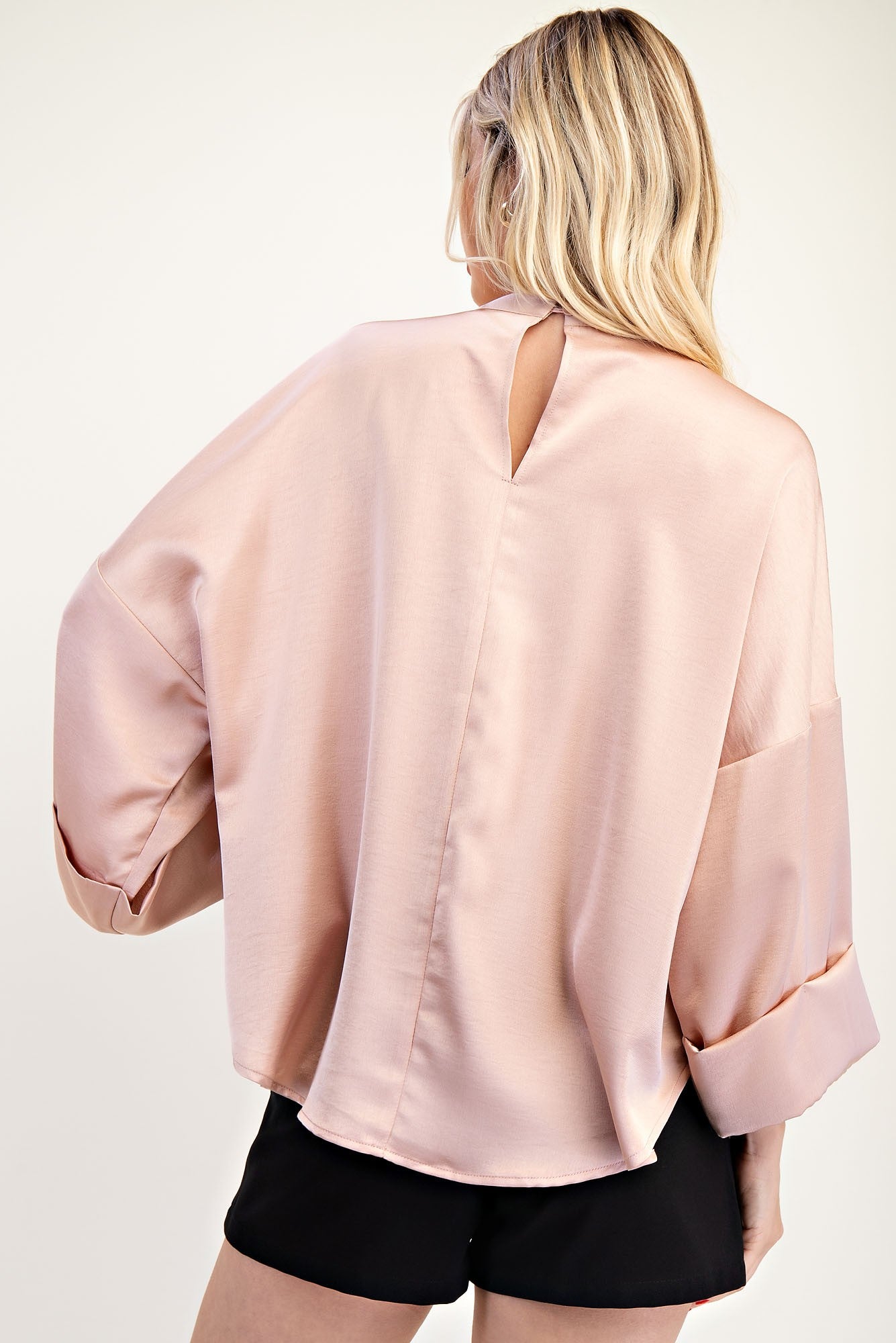 High Neck Wide Sleeve Top in pale pink with keyhole neckline. Available in sizes XS-XL.