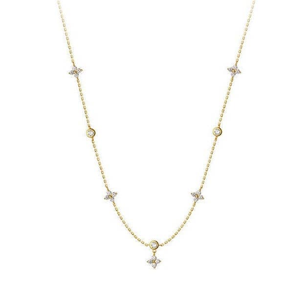 925 sterling silver necklace with four-petal flower charms and small round cubic zirconia. Available in multiple sizes.