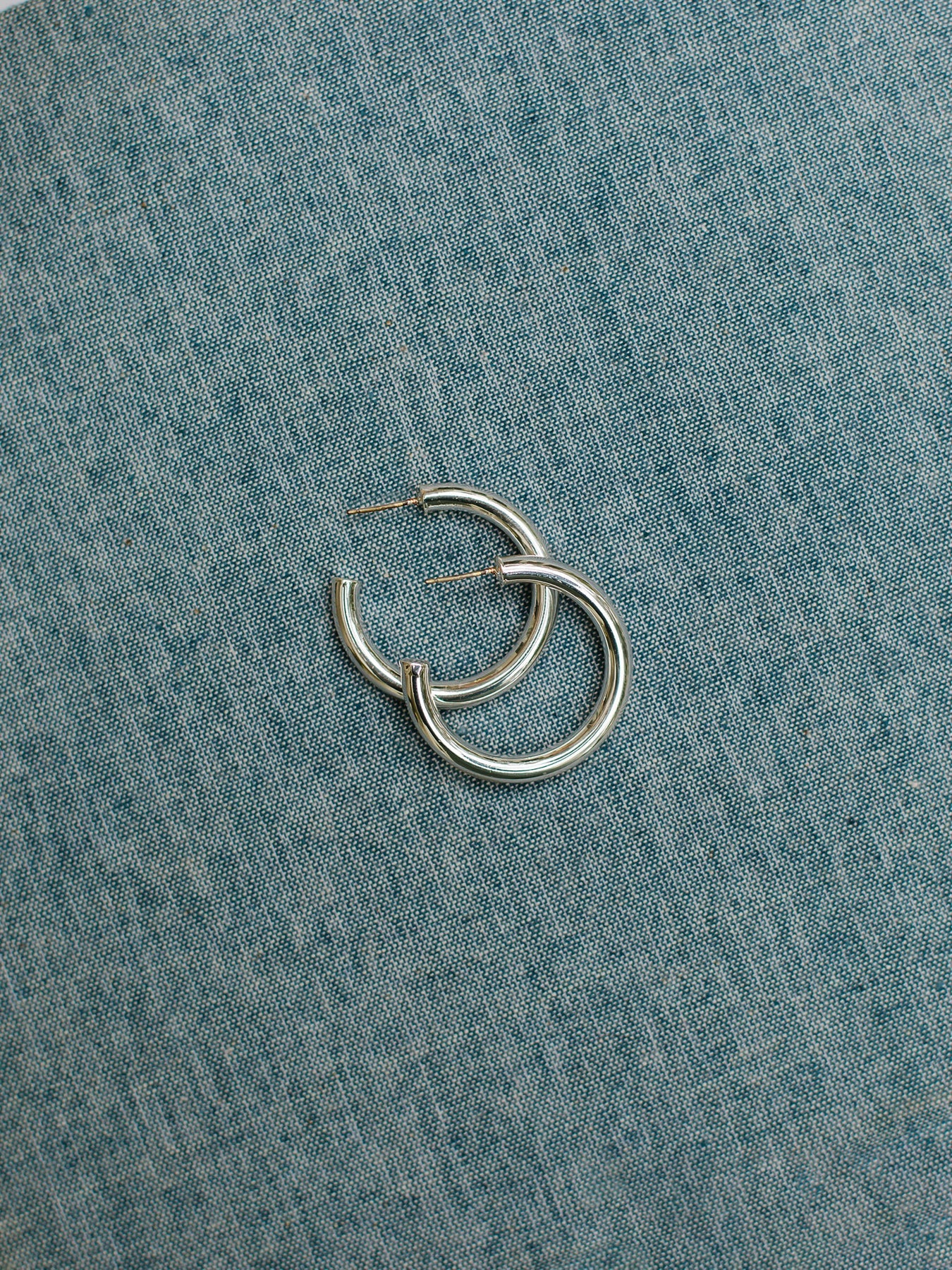 Cameron Silver hoop earrings with surgical steel posts. Available in a small size.
