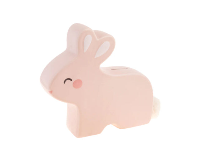 Pink bunny-shaped ceramic piggy bank for kids with coin slot, smiling face, white ears, fluffy tail. Sizes: small, medium, large.