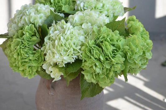 18" Large Bloom Supreme Real Touch Hydrangea in Light Green with realistic stems and leaves in a ceramic vase.