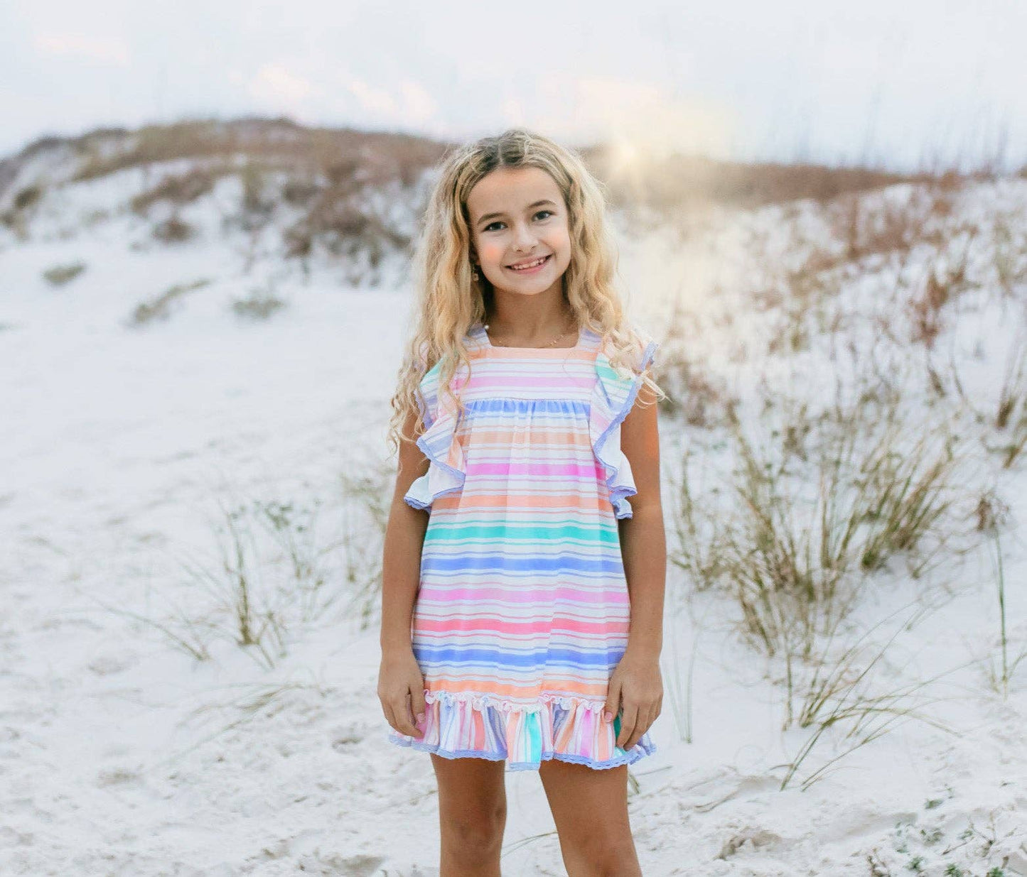Girls Pastel Rainbow Stripe Ruffles & Lace Spring Dress, available in sizes 2T-10, featuring lace and ruffle accents.