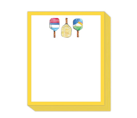 Short Stack Pad with yellow-bordered notepads. Top sheet features three pickleball paddles with playful icons and patterns. Sizes available: 4x6 inches and 5x7 inches.