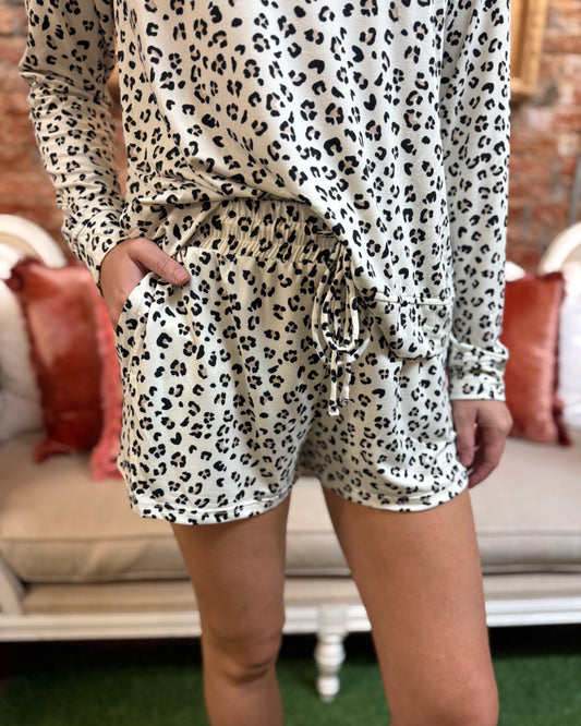 Annie Sweet Spot Short Set: two-piece pajamas with a white and black leopard print top and matching shorts. Available in sizes XS-XL.