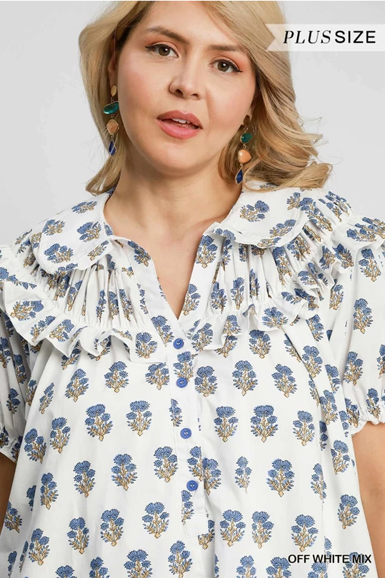 Plus-size off-white Bubble Sleeve Dress with blue/gold florals, ruffled collar, puff sleeves, blue buttons. Sizes: 1X-4X.