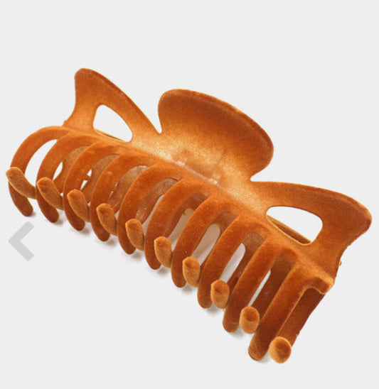 Brown velvet finish, curved design, interlocking teeth. Available in small, medium, and large sizes.