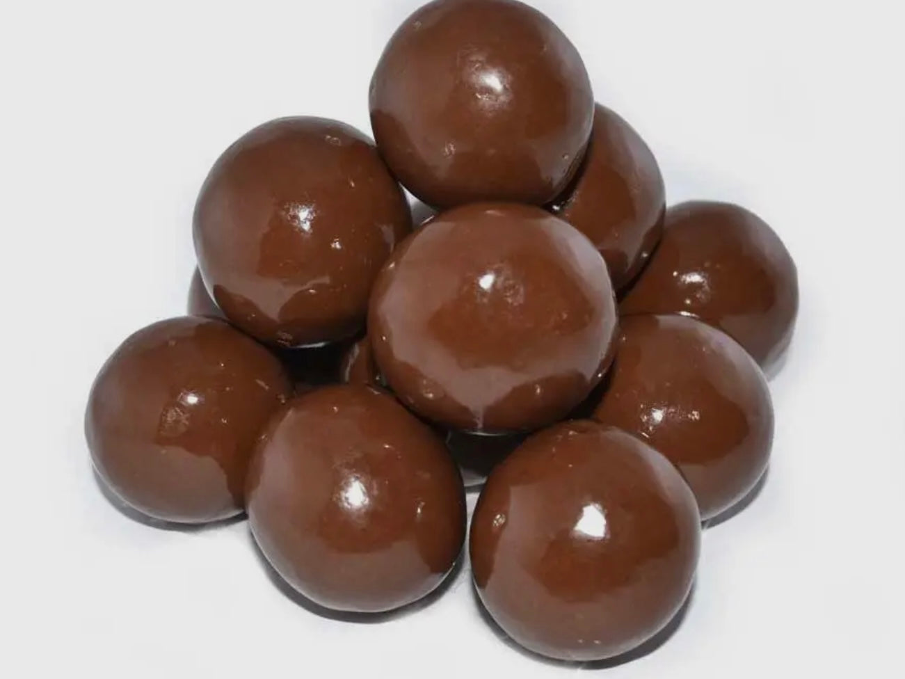 Chocolate Triple Dipped Malt Balls, 3.5oz, in a pile. Only the featured product is shown.