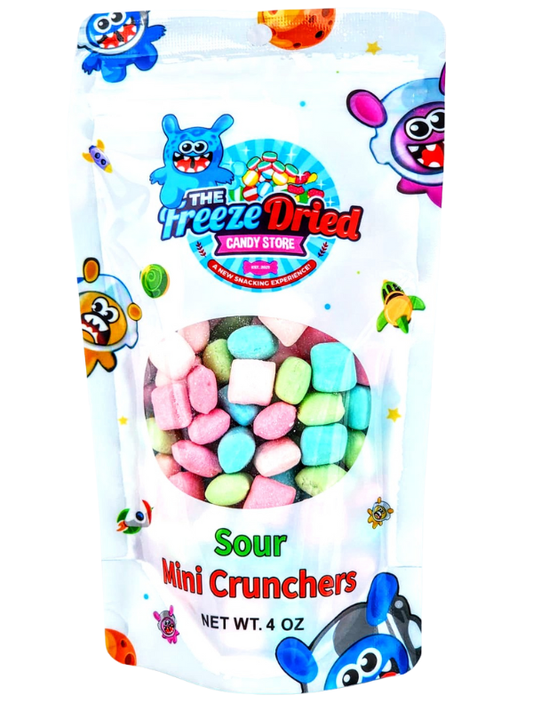 Colorful resealable 3 oz pouch of Sour Mini Crunchers, pastel pink, green, and blue crunchy snacks. Singles size available.