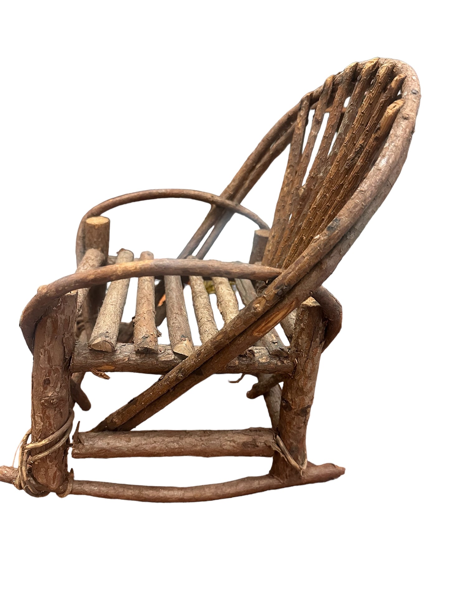 The Grapevine Doll Rocker has a slatted seat and back, made of unpolished branches and twigs. Available in small, medium, large.