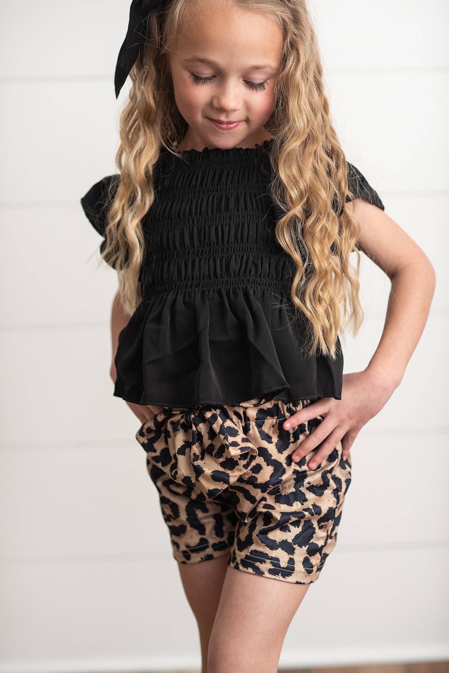 Girls Leopard Shirred Short Set: black short-sleeve top, leopard print shorts. Available in sizes 4-12.
